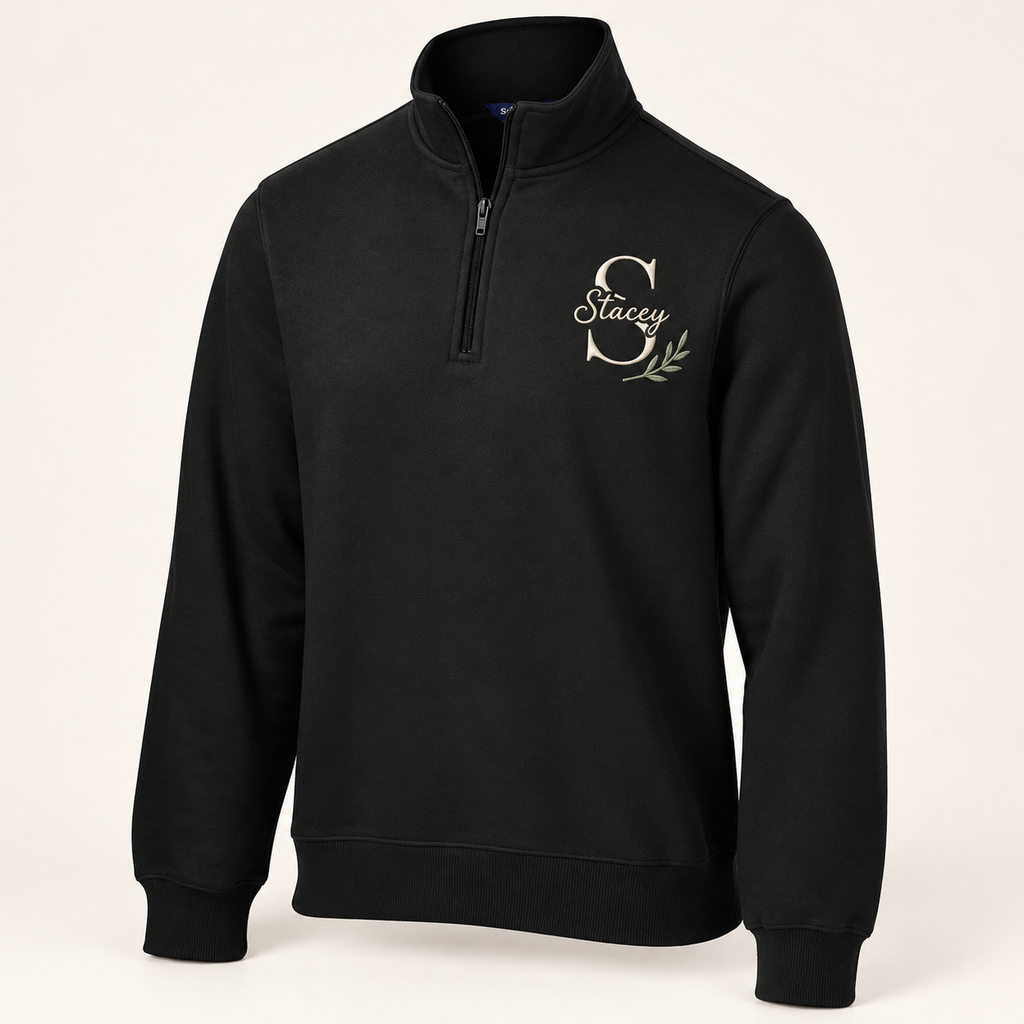Sport-Tek ST253 in Black — illustrative embroidered S and Stacey monogram with botanical accent