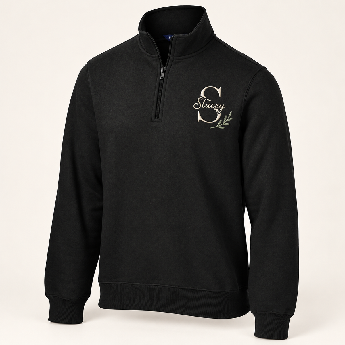 Sport-Tek ST253 in Black — illustrative embroidered S and Stacey monogram with botanical accent